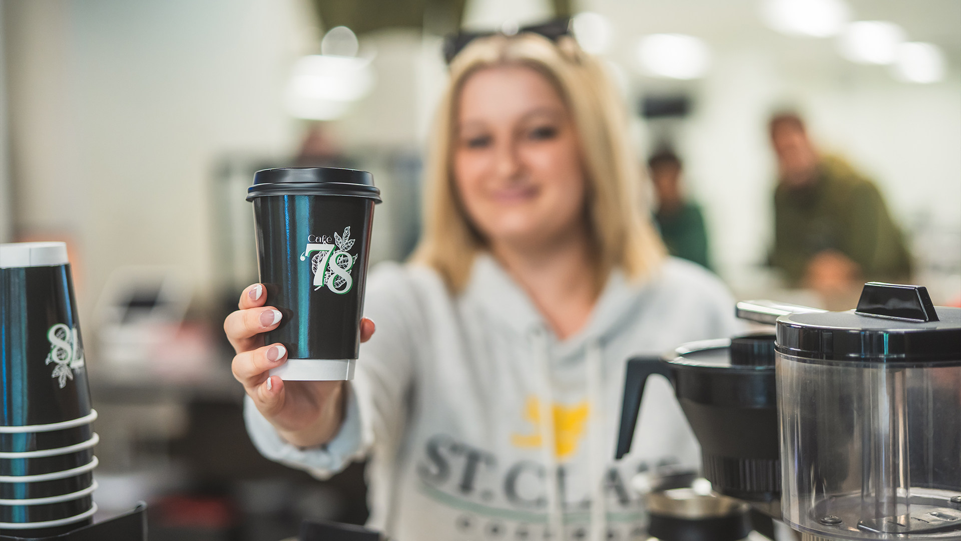 Woman holding a cup of coffee