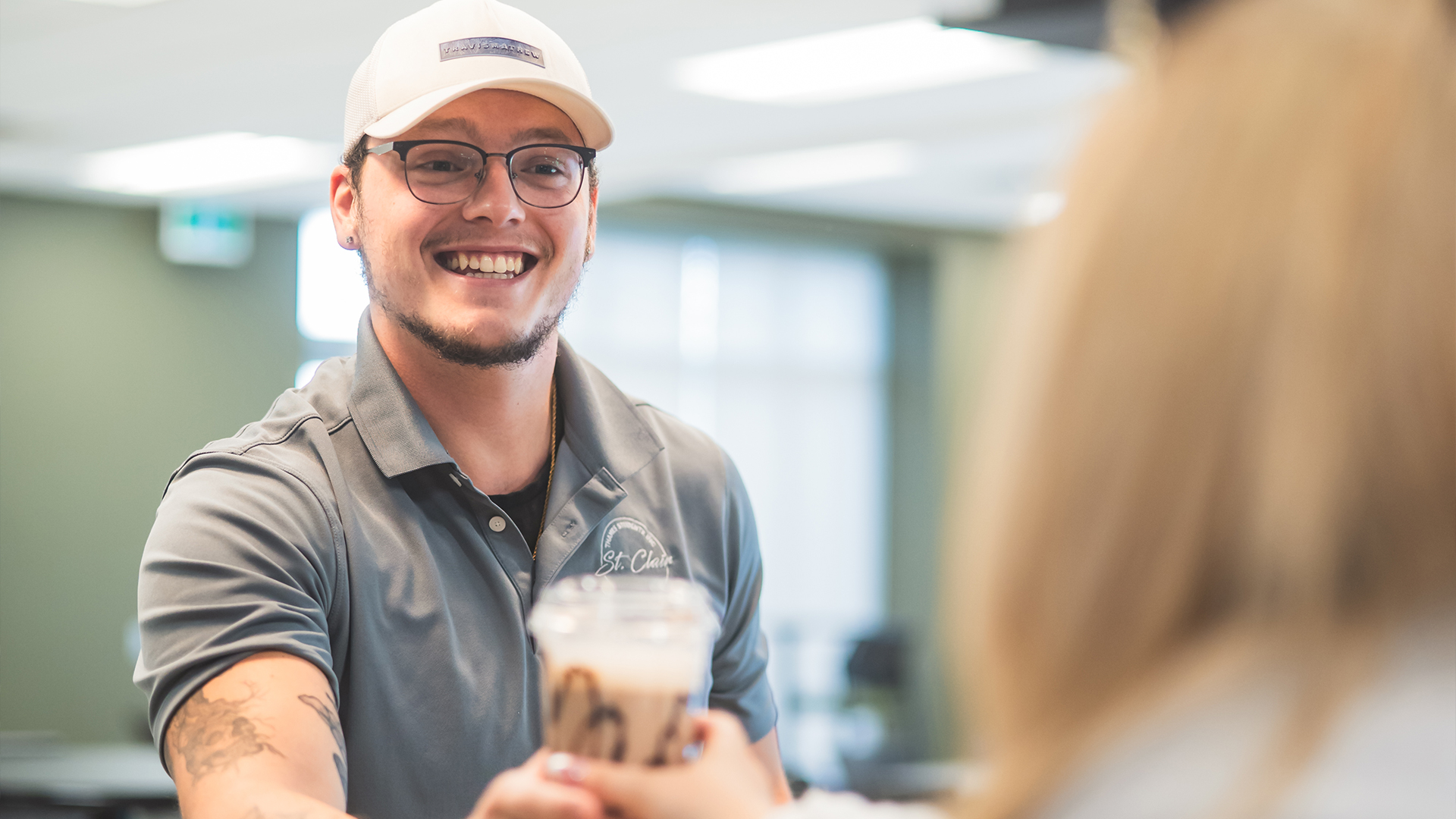 Man receive a cup of coffee